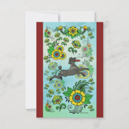 Un caniche noir attrape une carte de note Frisbee