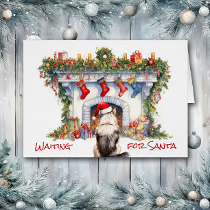 Un chien malamué attend la cheminée de Noël de Pèr