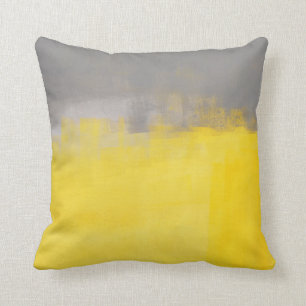 "" Un coussin gris et jaune abstrait simple d'art