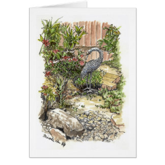 Un héron seul dans un jardin