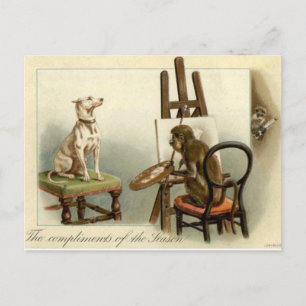 Un singe peint une carte de Noël pour chien