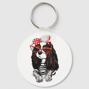 Unbekümmerter Königcharles Spaniel von Paris mit Schlüsselanhänger
