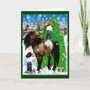 Une carte de Noël de cheval et d'enfant