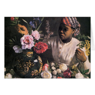 Une femme africaine plantant des fleurs dans un va