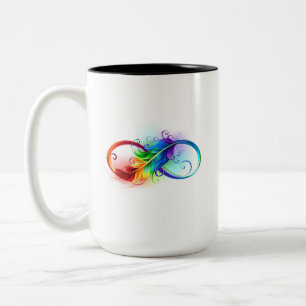 Unendliches Symbol mit Regenbogenfederhalter Zweifarbige Tasse