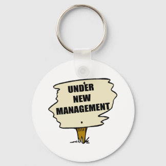 Unter dem neuen Management-Schlüsselanhänger Schlüsselanhänger