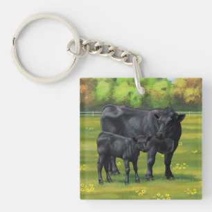 Vache d'Angus noir et veau mou en pâturage d'été