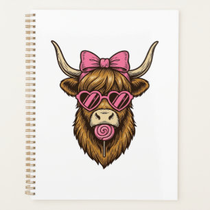 Vache des Highlands mignonne avec des lunettes à m