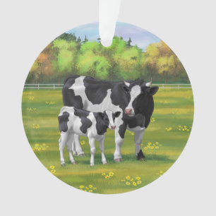 Vache Holstein et veau mignon en pâturage d'été