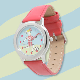 Vache jouant à la montre d'un enfant de football