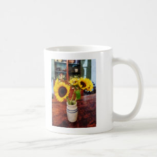 Vasenvase mit Sonnenblumen Kaffeetasse