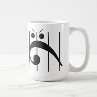 Verärgerter Bassschlüssel eingeschlossen Kaffeetasse