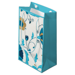 Vergoldete Indigo-Blumen mit weißem Hintergrund Kleine Geschenktüte