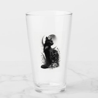 Verre Chat noir assis parmi le feuillage botanique
