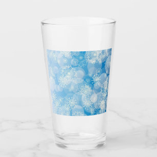 Verre Flammes de neige de Noël sur un arrière - plan ble