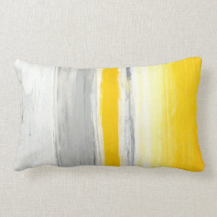 "Vers le bas au-dessous" du coussin gris et jaune