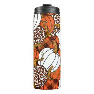 Verschiedene Kürbis. Leopard, orange, weiß und Thermosbecher