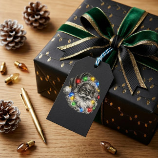 Verspielter schwarzer Weihnachtsmann mit farbenfro Geschenkanhänger