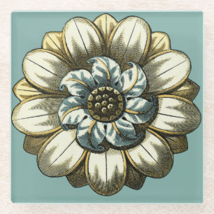 Verziertes Blumenmedaillon auf hellblauem Glasuntersetzer