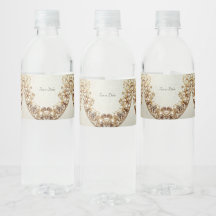 Verziertes goldenes Wasserflaschenetikett mit Schn