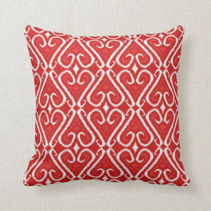 Vibrierendes ikat Muster im Rot und im Gold Kissen