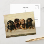 Vier Dackeln Welpen | Carl Reichert Postkarte<br><div class="desc">Vier Dackeln Welpen | Carl Reichert’s Four Dackel Welpen ist ein bezauberndes Gemälde, das die Unschuld und den Charme von vier kleinen Welpen der Dackel einfängt. Das in neutralen Erdtönen präsentierte Kunstwerk betont ihre weichen Fell- und expressiven Gesichter und zeigt Reichert außergewöhnliche Fähigkeiten bei der Erstellung lebensähnlicher Tierportraits. Die harmonische...</div>