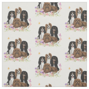 Vier Kavalier King Charles Spaniels in Blume Stoff