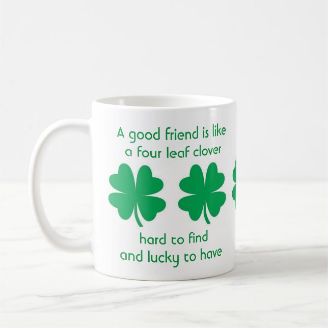 Vier Leaf Clovers und Tasse der besten Freunde (Links)