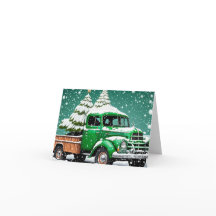 Vieux Camion vert avec sapin de Noël à l'arrière.