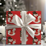 Vintag Retro Jolly Snowman in Top Hat Christmas Geschenkpapier<br><div class="desc">Dieses lustige und festliche Urlaubspapier ist ein Rückfall auf die klassischen Weihnachtsdesigns der Mitte des Jahrhunderts. Ein gemustertes Design mit einem fröhlichen Schneemann,  der einen Top-Hut trägt,  Schal und einen Bonbonstock vor einem traditionellen weihnachtroten Hintergrund hält,  der Ihren Geschenken eine Vintage klassische Touch verleiht.</div>
