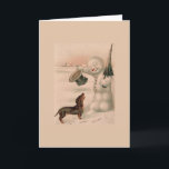 Vintag - Snowman grüßt eine Dackel, Feiertagskarte<br><div class="desc">Ein Vintages Beispiel dafür,  wie ein Schneemann seinen Oberhut abhaut und sich den Kopf in Gruß an einen Dackel-Hund beugt,  der sich ihm an einem schneebedeckten Wintertag nähert.  Diese Karte ist leer für Ihre eigene Nachricht.</div>