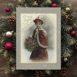 Vintage Dame im Schnee mit Weihnachtsgrüßen Feiertagskarte<br><div class="desc">Liebliche Viktorianische Dame in rotem Kap gekleidet mit einem Strauß heiligen Schnees mit Weihnachtsgrüßen.</div>