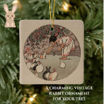 Vintage Kaninchenkunst Niedlicher Kern Keramikornament<br><div class="desc">Dieses charmante Cottagecore-inspirierte Keramik-Ornament besticht durch eine Reproduktion von "Fütternd Bunnies", niedlicher Vintager Kaninchenkunst des amerikanischen Künstlers Helen Hyde. Ein Mädchen füttre eine Gruppe flauschiger Waldkaninchen, die zu ihren Füßen in sanften Tönen in Pastellrosa, Grau und Beige versammelt sind. Ein süßes und schönes Bild und ein perfektes Geschenk für Ostern...</div>