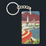 Vintage Reise die Schweiz Schlüsselanhänger<br><div class="desc">Vintage Grafik einer klassischen Seeseitenszene bei Lago Maggiore in Tessin,  die Schweiz mit einer Zahl saß unter einem großen roten und weißen Sonneregenschirm im Vordergrund.</div>