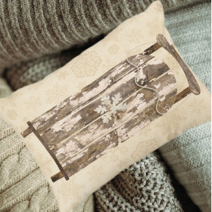 Vintage-Schneeschlitten aus Holz mit Schneeflocken Dekokissen