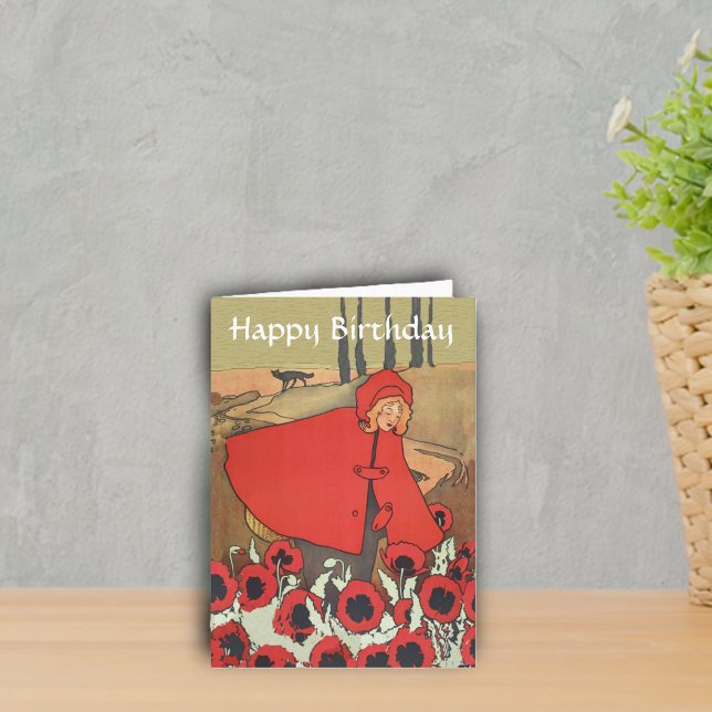 Vintager roter karte (Red riding hood red cape picking poppy flowers with wolf in background on Happy Birthday card.)