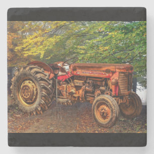 Vintager roter Zuchttraktor Steinuntersetzer