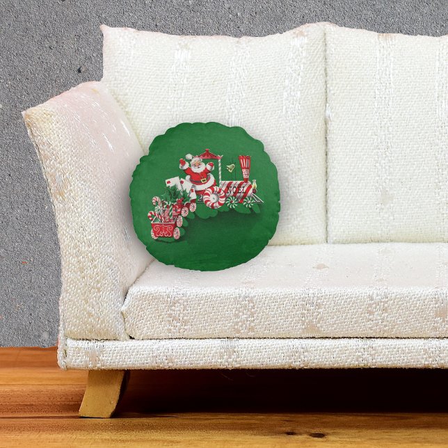 Vintager Santa Claus Peppermint Candy Train Rundes Kissen (Cute Santa Claus riding red white Christmas Train with candy letters on green decorative pillow.)