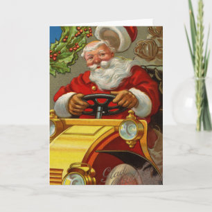 Vintager Weihnachtsmann, der eine gelbe Autokarte  Feiertagskarte