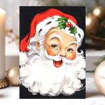 Vintager Weihnachtsmann Feiertagskarte<br><div class="desc">Der Vintage Weihnachtsmann steht vor der Weihnachtskarte. Dieses Design hat einen lächelnden Weihnachtsmann auf einem schwarzen Hintergrund. Was für eine schöne Retro-Urlaubsszene. Personalisieren Sie dieses maßgeschneiderte Design mit Ihrem eigenen Innen-Gruß.</div>
