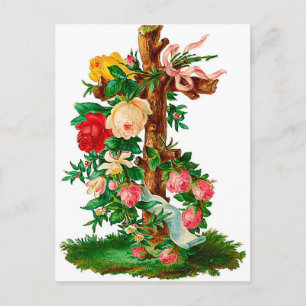 Vintages Holzkreuz mit einem Strauß an Rose. Postkarte