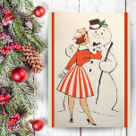 Vintages Retro Girl mit Snowman Custom Christmas Feiertagskarte<br><div class="desc">Diese lustige Retro-Weihnachtskarte zeigt eine junge Frau aus der Mitte des Jahrhunderts,  die die Bogen-Krawatte eines schneidenden Schneemanns ausgleicht. Personalisieren Sie diese,  indem Sie die Nachricht innerhalb der Karte anpassen und/oder Ihren Namen hinzufügen.</div>