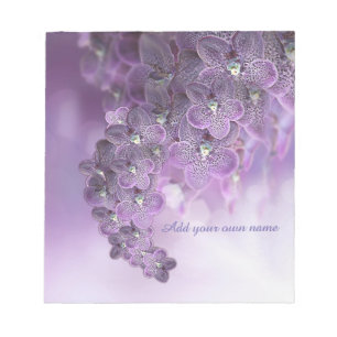 Violette lila blühende Orchideenblumen Notizblock