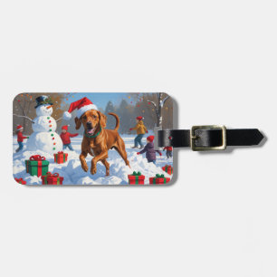 Vizsla läuft im Schnee mit Weihnachtsmütze Gepäckanhänger