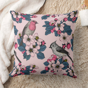 Vögel und Blüten auf rosa Kissen