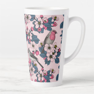 Vögel und Blüten auf rosa Milchtasse