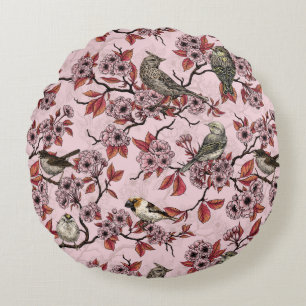 Vögel und Kirschblüten auf rosafarbenem Hintergrun Rundes Kissen