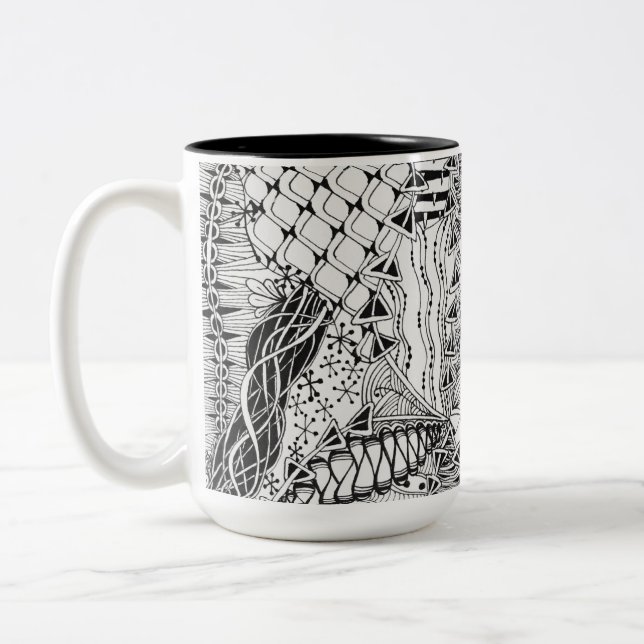 Von Hand gezeichnete schwarze u. weiße Zweifarbige Tasse (Links)