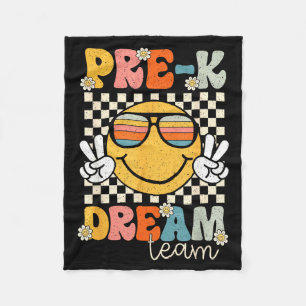 Vorkindertraum-Team lächelt retro zurück zur Schul Fleecedecke