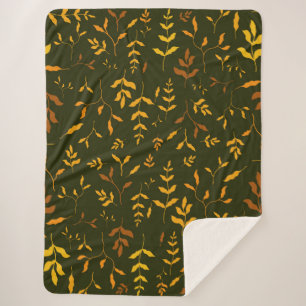 Warme Herbstgoldblätter dunkelgrünes Muster Sherpadecke